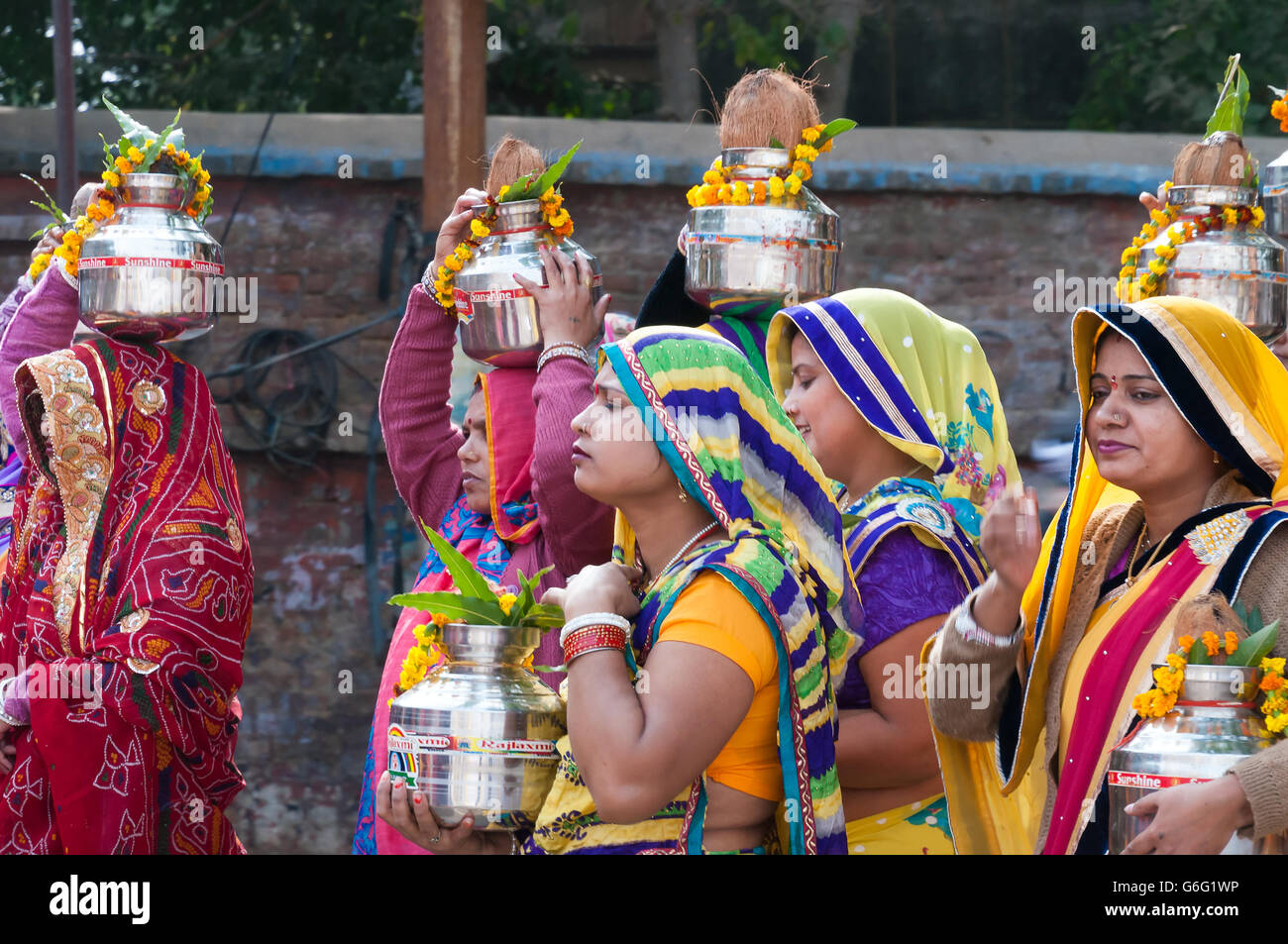 Indian women with pot on their heads in Ritual procession on the street ...