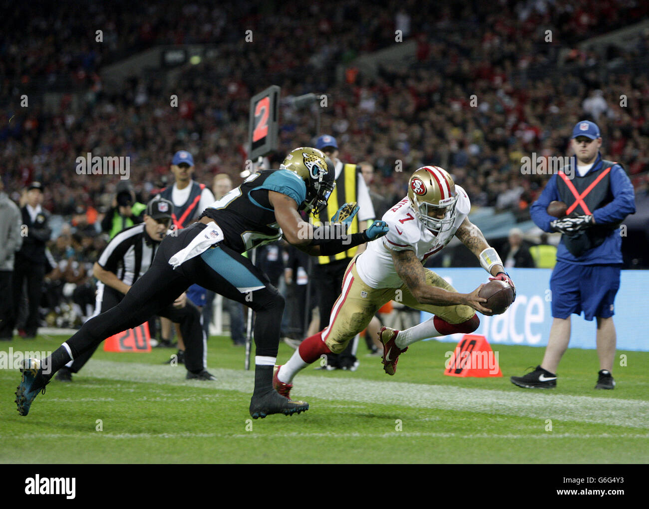 San Francisco 49ers' Colin Kapernick dives in to score his sides second touchdown of the game to the NFL International match at Wembley Stadium, London. Stock Photo