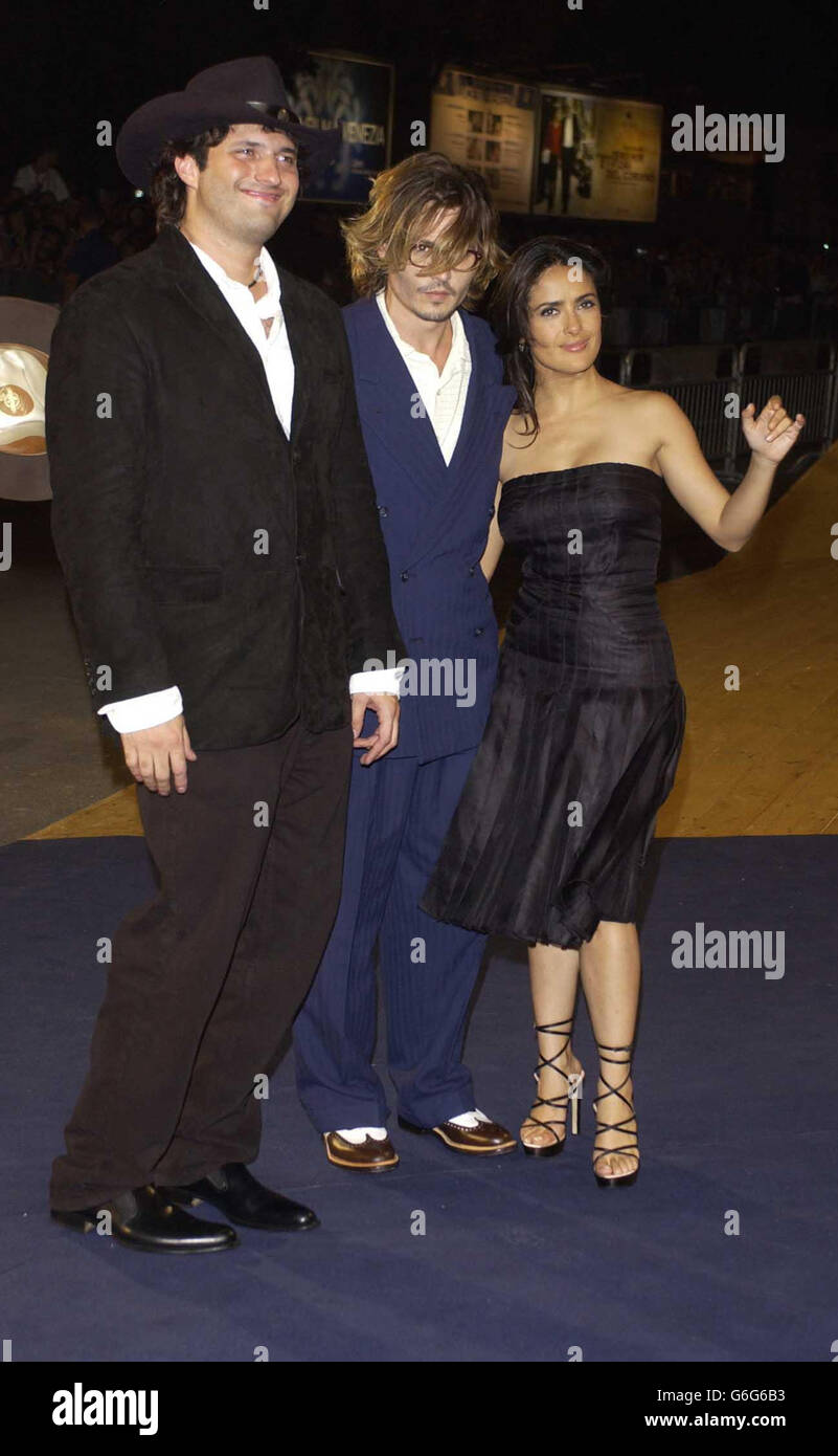Director Robert Rodriguez (left) and actors Johnny Depp and Salma Hayek arrive at the Palazzo del Cinema, Lido, Venice, for a special screening of their new film 'Once upon a time in Mexico' at the 60th International Exhibition of Cinema Art, better known as Venice Film Festival. Stock Photo