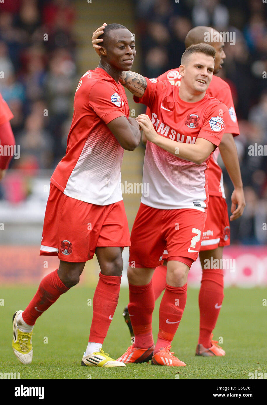 Leyton Orient's Moses Odubajo (left) celebrates scoring his side's first goal with team mate Dean Cox during the Sky Bet League One match at the Matchroom Stadium, London. Stock Photo