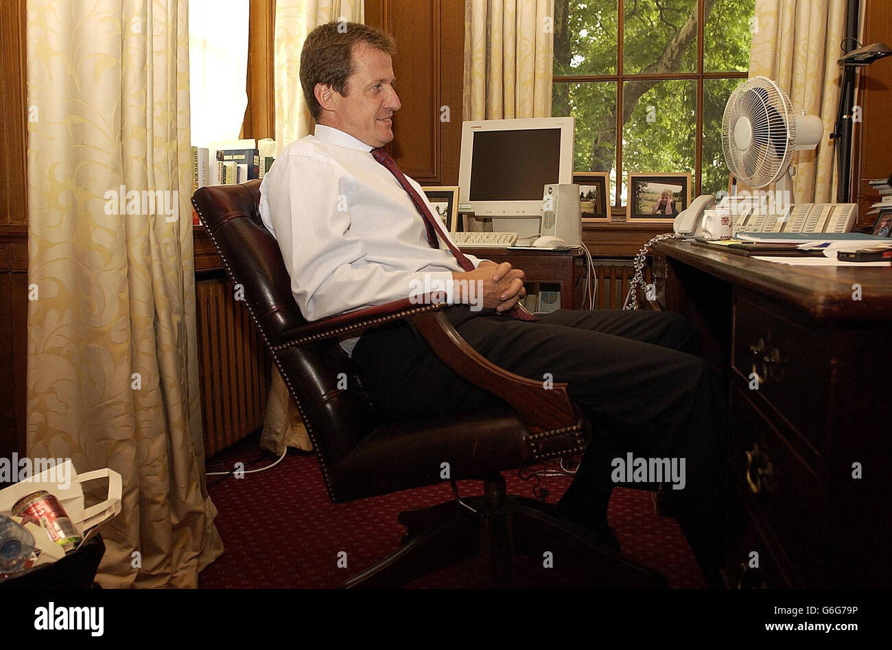 Alastair Campbell in his office in Downing Street after announcing his resignation as Director of Communications to Prime Minister Tony Blair, in London. Blair's top aide announced his resignation on Friday in a shock decision that comes amid the worst crisis of the British premier's six-year rule. Stock Photo