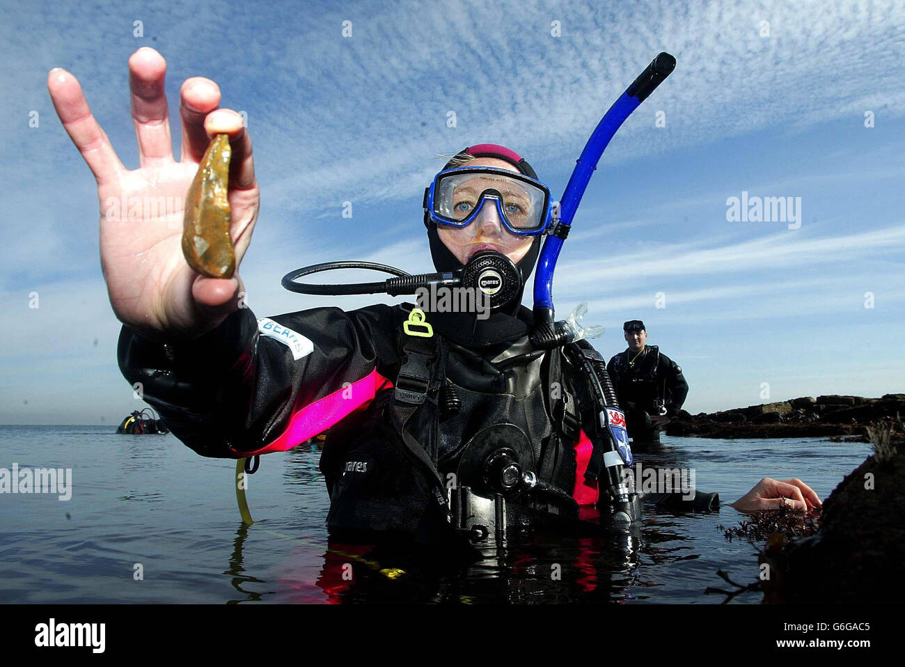 Dr Penny Spikins in the north sea at Tynemouth, with a stone found by her team of scuba-diving archaeologists when they discovered an undersea settlement that could be 10,000 years old. The settlement, found in the mouth of the River Tyne, is believed to be the country's second submerged Stone Age development. Stock Photo