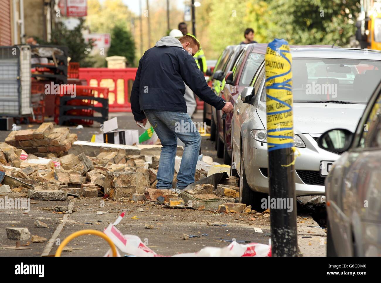 Damaged cars on Francis Road in Leyton, east London, where scaffolding