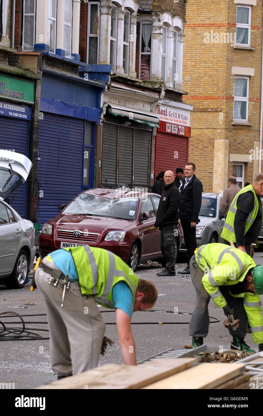 Damaged cars on Francis Road in Leyton, east London, where scaffolding