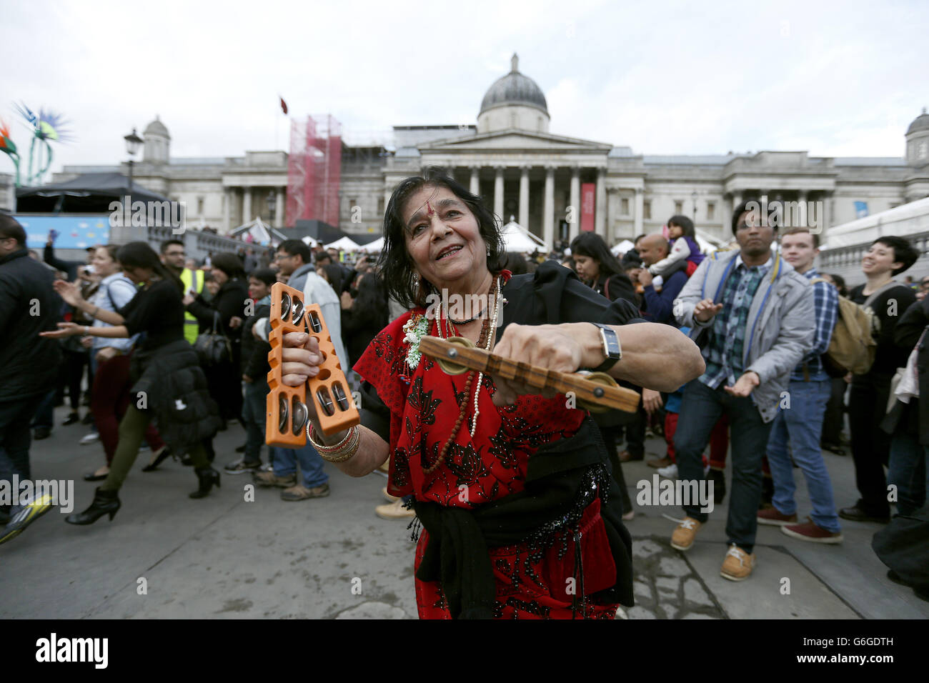 Revellers celebrate Diwali with traditional Garba dancing in Trafalgar Square, central London. Stock Photo