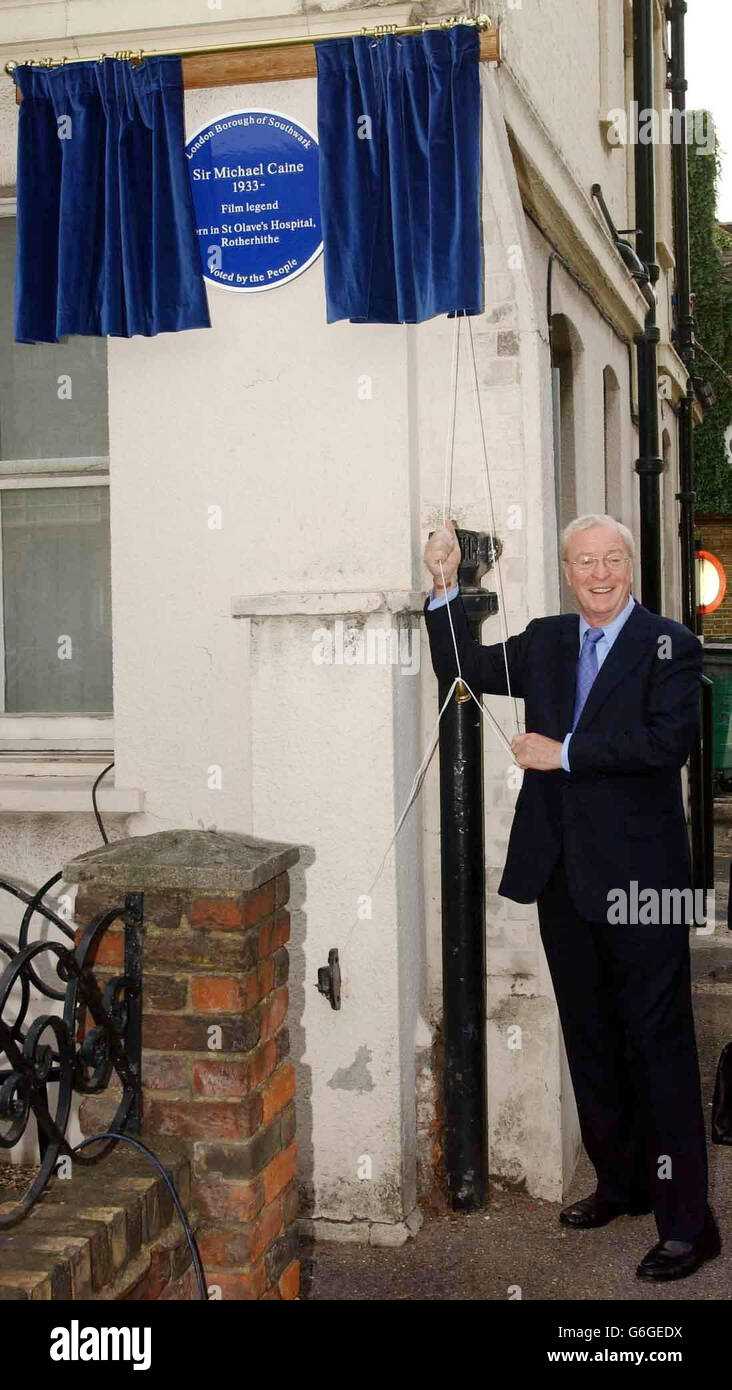 Hollywood legend Sir Michael Caine unveiling a plaque, to mark his birthplace at the site of the former St Olave's hospital in Rotherhithe, south east London. Sir Michael - the star of classic British films like Alfie, Get Carter and The Italian Job - told how he arrived 30 minutes early for the unveiling ceremony so he could drive around his old neighbourhood and marvel at how 'great' the area looked. The Hollywood star was one of 20 people voted for by the public as part of Southwark Council's Blue Plaque project, which is separate to the English Heritage Scheme. Stock Photo