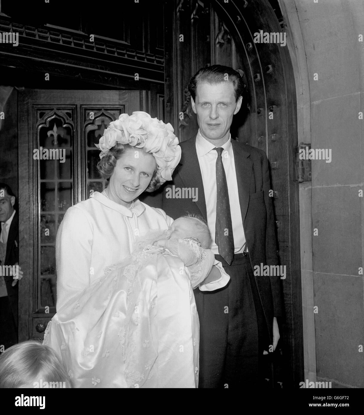 Ian Gilmour, National Liberal-Conservative MP for Central Norfolk, and his wife, Lady Caroline Gilmour, with their youngest son Andrew James after the baby's christening in the crypt of the House of Commons, London, by the Reverend Simon Phipps. Stock Photo