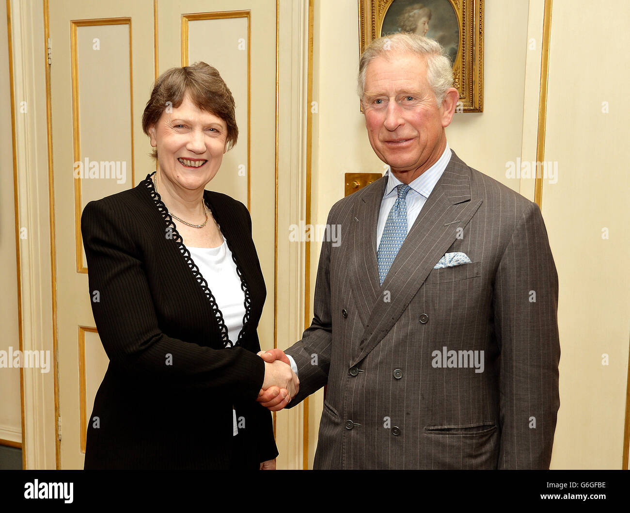 The Prince of Wales shakes hands with Helen Clark the former Prime Minister of New Zealand, during a private meeting in the Garden room at Clarence House in central London. Stock Photo
