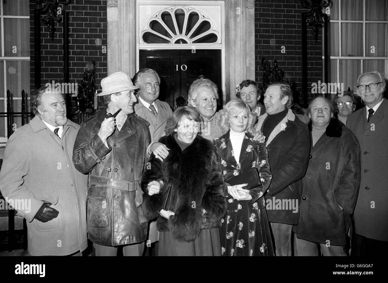 A group of show business personalities outside 10 Downing Street, where they handed in a petition opposing British Rail's decision to close down the train service on Boxing Day, and possibly preventing visits to theatres and cinemas. They include (from second left) Ron Moody, Derek Bond, Lulu, Danny La Rue, Sheila White, Richard Briers, Leslie Phillips and Roy Kinnear. Stock Photo