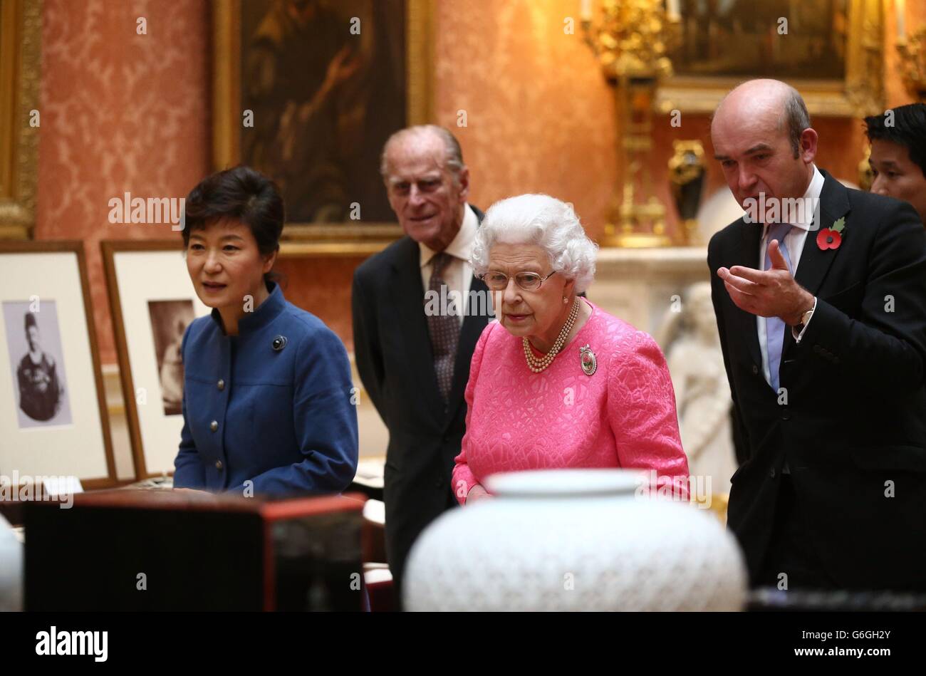 The President of the Republic of Korea Park Geun-Hye (left), the Duke of Edinburgh (second left) and Queen Elizabeth II (second right) arrive to look at an exhibition of Korean related items from the Royal Collection and Royal Archives in the Picture Gallery of Buckingham Palace in London, England. The President of the Republic of Korea Park Geun-Hye is on a State Visit to the United Kingdom and during the trip she will attend a state banquet and visit Downing Street. Stock Photo