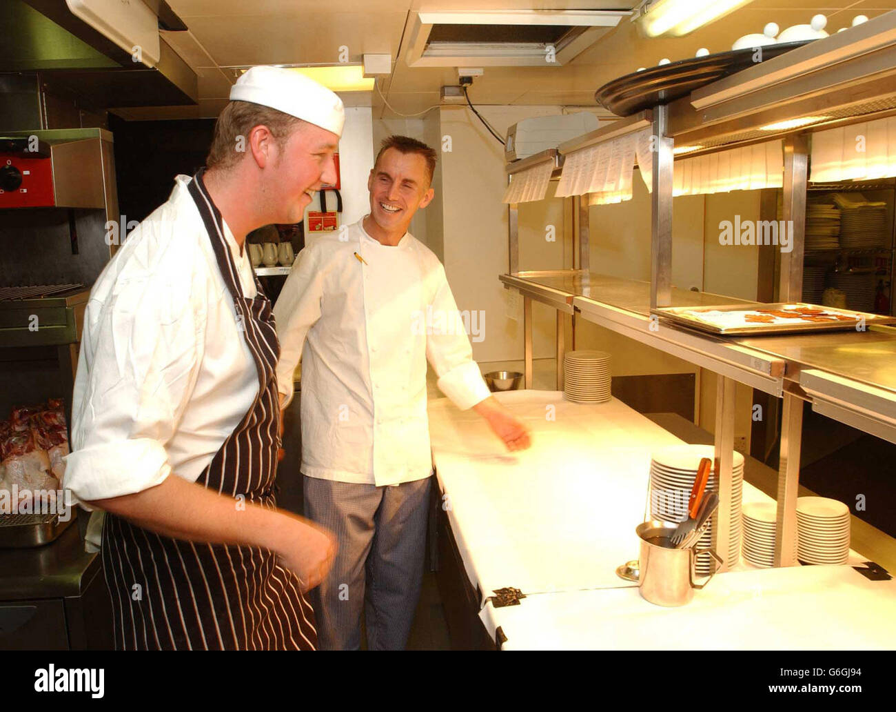 Chef Gary Rhodes in the kitchen during the launch of his Restaurant Rhodes Twenty Four, located on the 24th floor of the City of London's most impressive and tallest building Tower 42, Old Broad Street. Rhodes promises to bring back traditional Briish Crusine in an outstanding location, with its stunning views across the capital. Stock Photo