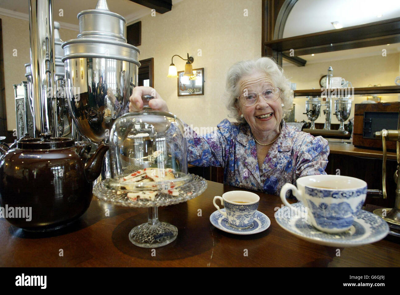 Margaret Barton, who starred in the 1945 movie Brief Encounters stands in the refurbished refreshment bar at Carnforth train Station. The station which was immortalised in the classic British film Brief Encounter was officially re-opened after its refurbishment. Carnforth Station in Lancashire was opened in 1846 by the Lancaster and Carlisle Railway Company as a roadside 'second class' station and was originally just a single platform. Stock Photo