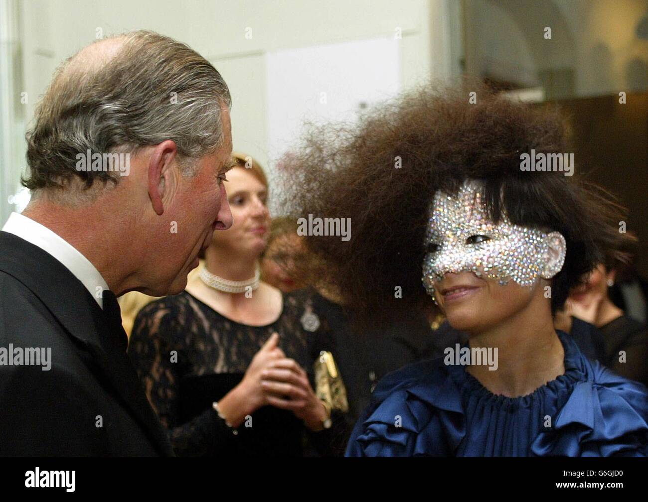 NO MERCHANDISING. HRH The Prince of Wales (L) speaks with singer Bjork during the reception at the 'Fashion Rocks' concert and fashion show, in aid of The Prince's Trust at the Royal Albert Hall in London. Stock Photo