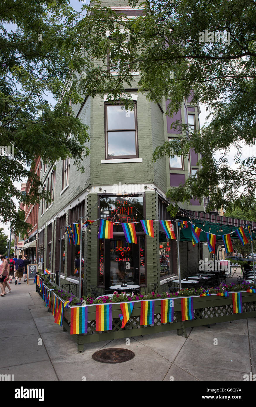 Corner bar displaying Gay Pride flags. Stock Photo