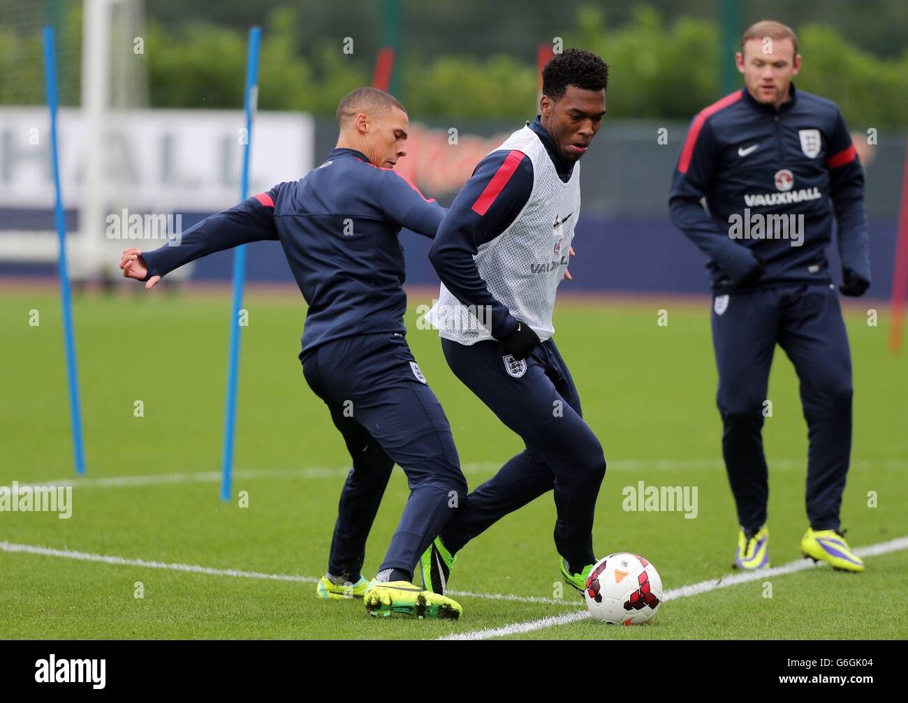 Soccer - FIFA World Cup Qualifying - Group H - England v Poland - England Training Session - London Colney. England's Daniel Sturridge with Keiron Gibbs (left) and Wayne Rooney (right) during the training session at London Colney, Hertfordshire. Stock Photo