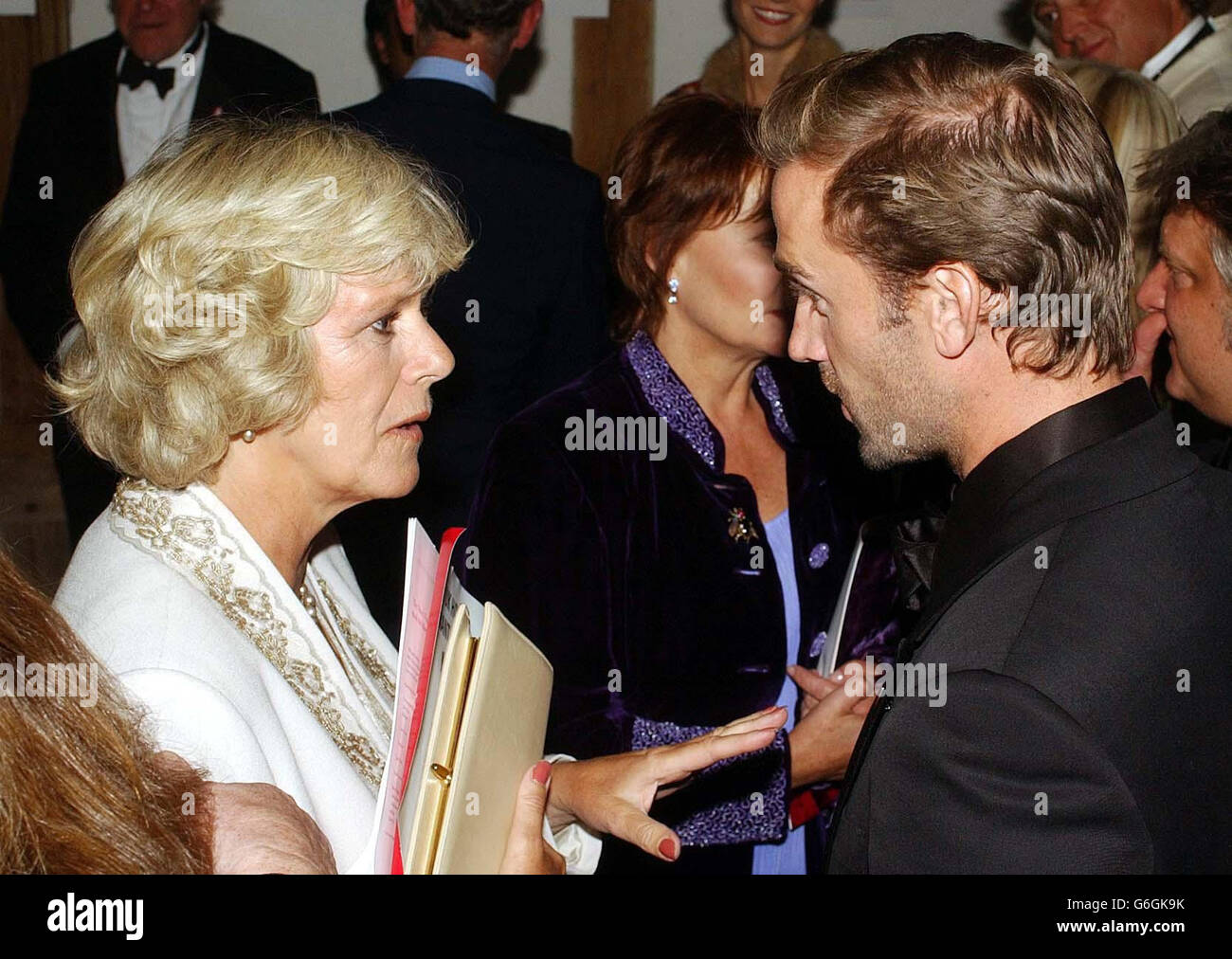 Camilla Parker Bowles meets Joseph Fiennes at the Globe Theatre on London's South Bank, after a Shakespeare Gala evening in aid of the Prince's Trust. Camilla Parker Bowles accompanied The Prince Wales to watch stars of film and stage put on a Shakespearean spectacle with Oscar winner Gwyneth Paltrow joining a host of acclaimed actors who performed scenes from the bard's famous plays. The gala evening has already raised 100,000 in aid of the Prince's Trust, which aims to help disadvantaged youngsters. Stock Photo