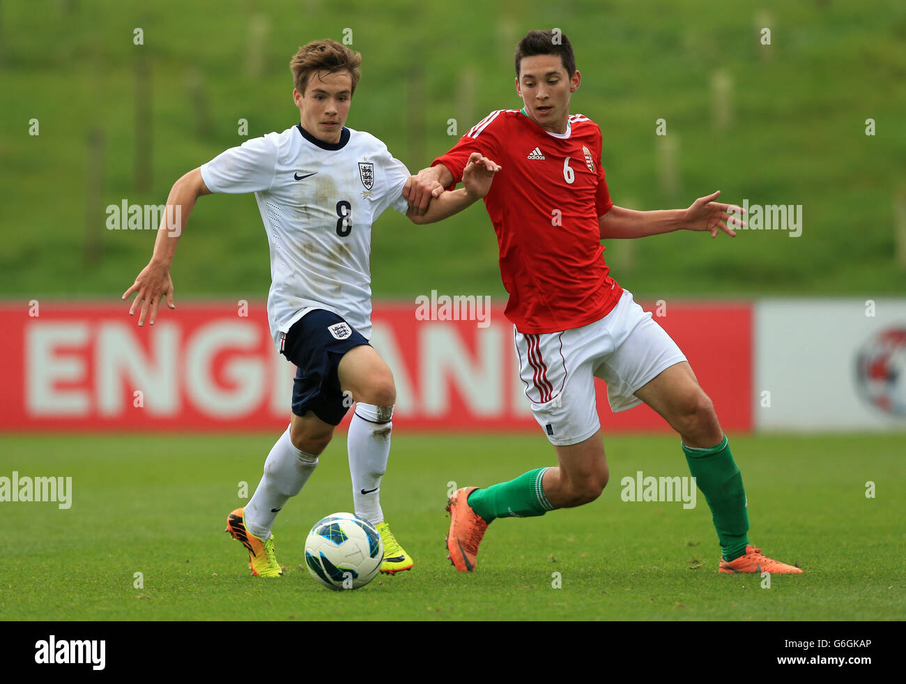 Soccer - Under 18's International - England v Hungary - St George's Park. England's Will Miller and Hungary's Vida Mate Stock Photo