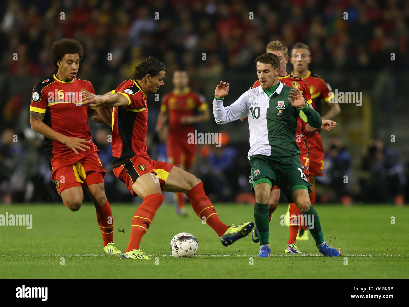 Belgium's Daniel Van Buyten and Wales' Aaron Ramsey in action during the FIFA 2014 World Cup Qualifying, Group A match at the Koning Boudewijnstadion, Brussels, Belgium. Stock Photo