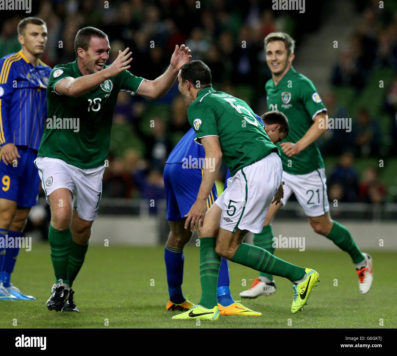 Republic of Ireland's John O'Shea (right) celebrates with team-mate Richard Dunne after scoring his side's second goal during the FIFA 2014 World Cup Qualifying, Group C match at the Aviva Stadium, Dublin. Stock Photo