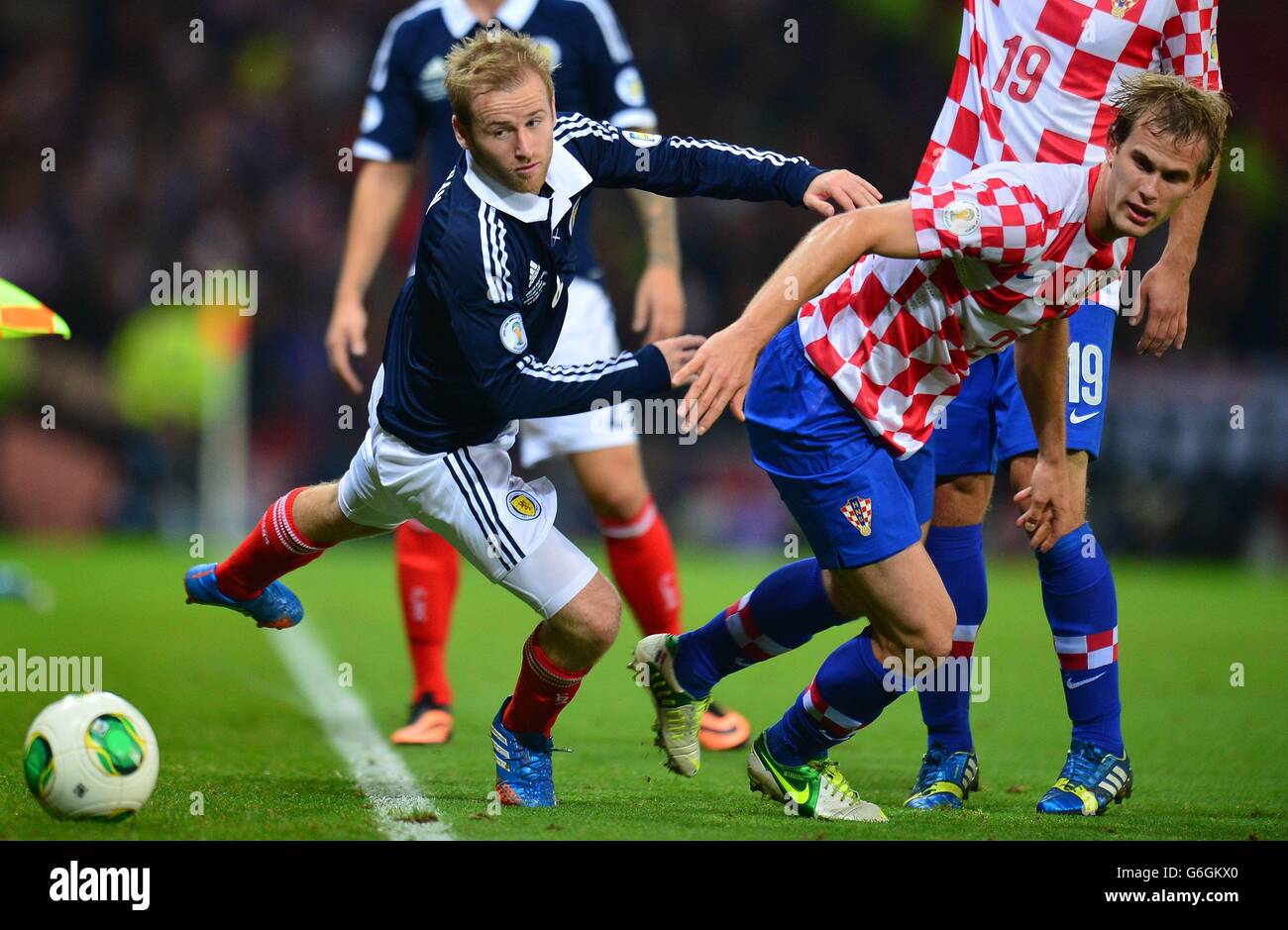Scotland's Barry Bannan and Croatia's Ivan Strinic (right) in action during the FIFA 2014 World Cup Qualifying, Group A match at Hampden Park, Glasgow. Stock Photo