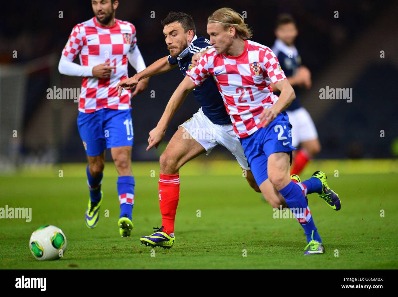 Scotland's Robert Snodgrass (centre) and Croatia's Domagoj Vida in action during the FIFA 2014 World Cup Qualifying, Group A match at Hampden Park, Glasgow. Stock Photo