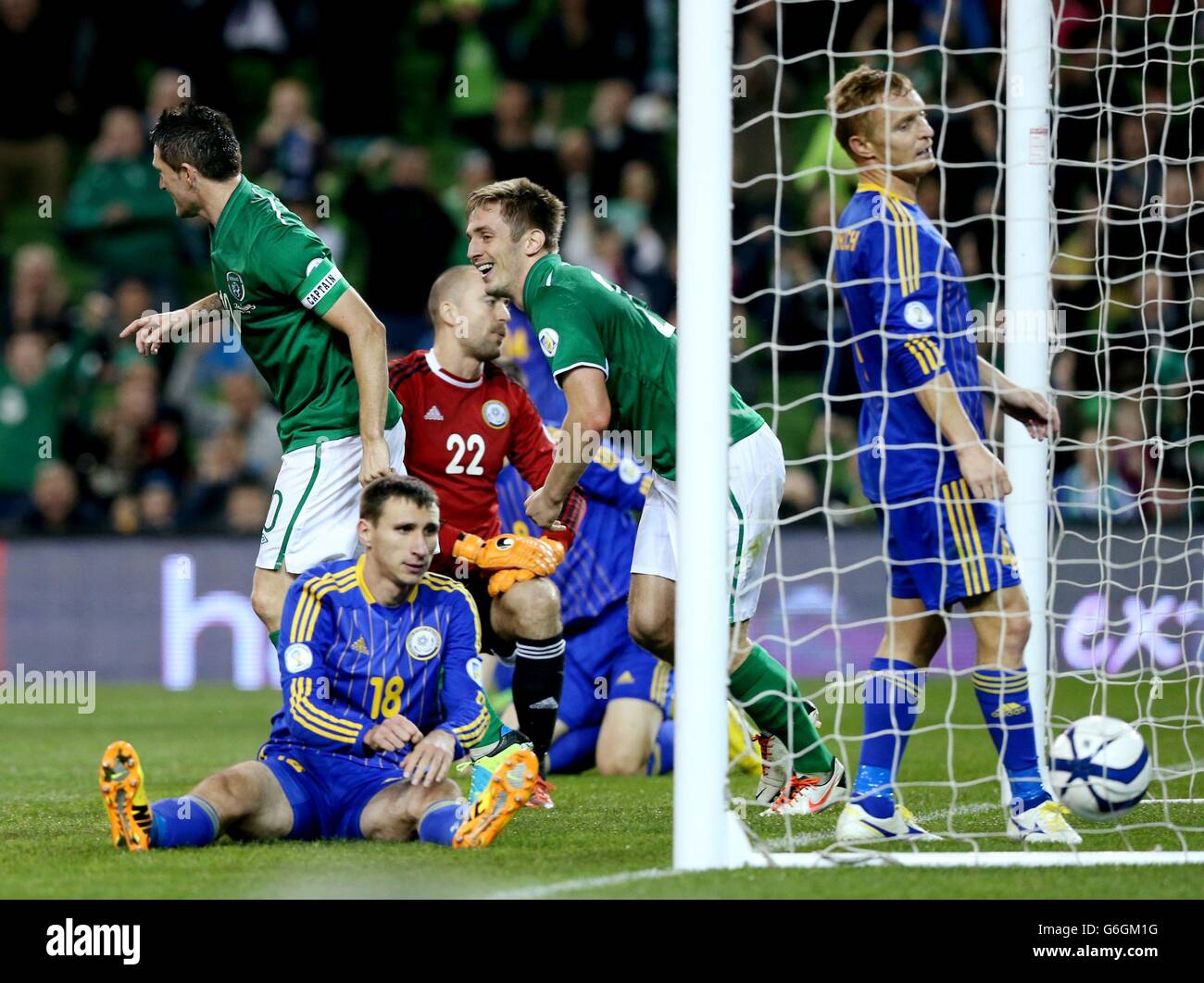 Republic of Ireland's Kevin Doyle and Robbie Keane (left) celebrate after Kazakhstan's Dmitriy Shomko (second left) scored an own goal during the FIFA 2014 World Cup Qualifying, Group C match at the Aviva Stadium, Dublin. Stock Photo