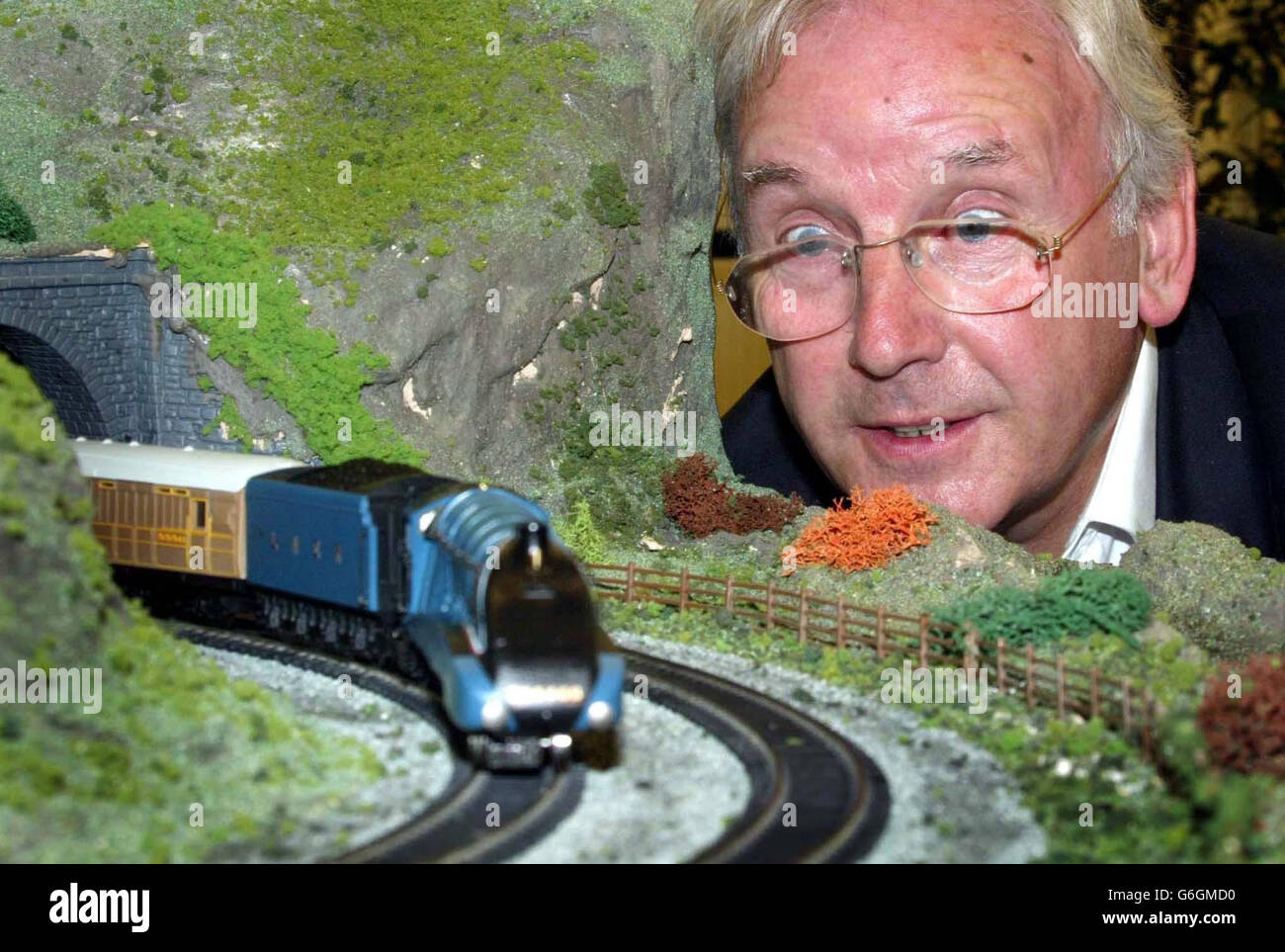 Railway enthusiast and pop impresario Pete Waterman looks on as Hornby launches its first Live Steam Locomotive, the Mallard, part of it's new 'OO' gauge Live Steam working models range at the Goodwood Revival Meeting. Hornby said the first model - the classic A4 Mallard, would be in the shops in time for Christmas. Stock Photo