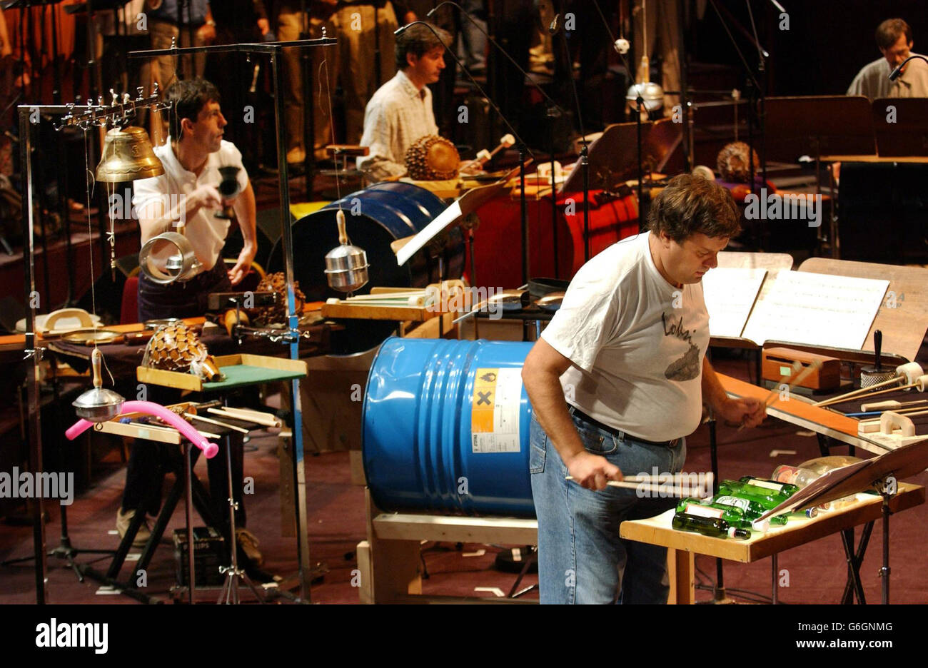 Zoltan Rasz, of Hungarian 'Amandinda Percussion Group' who make music with unusual instruments, playing assorted bottles, during a rehearsal at London's Albert Hall. Stock Photo