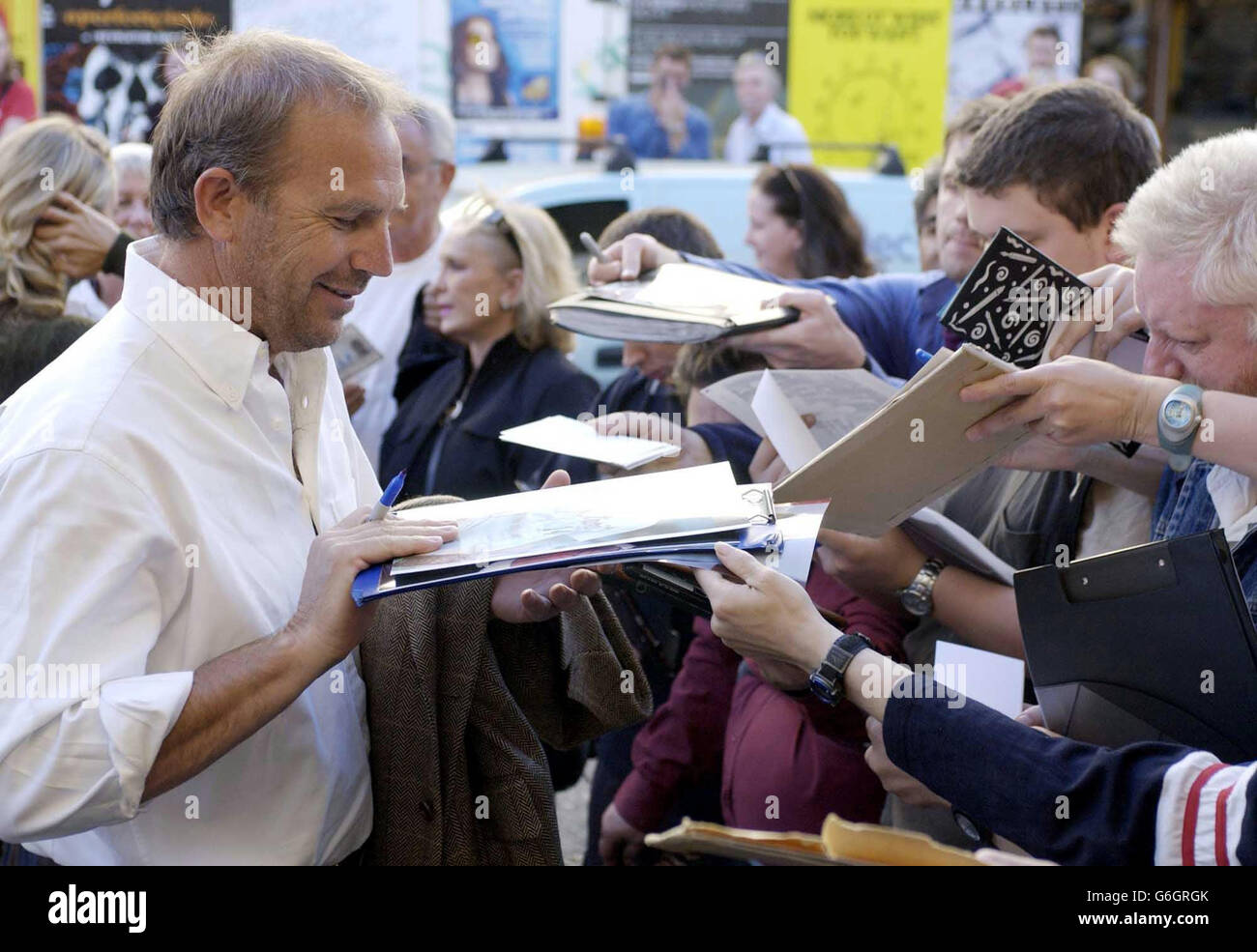 American actor Kevin Costner signs autographs for the fans before he introduces the Oscar-winning 1967 classic film Cool Hand Luke, at the Electric Cinema, Notting Hill, London. Stock Photo
