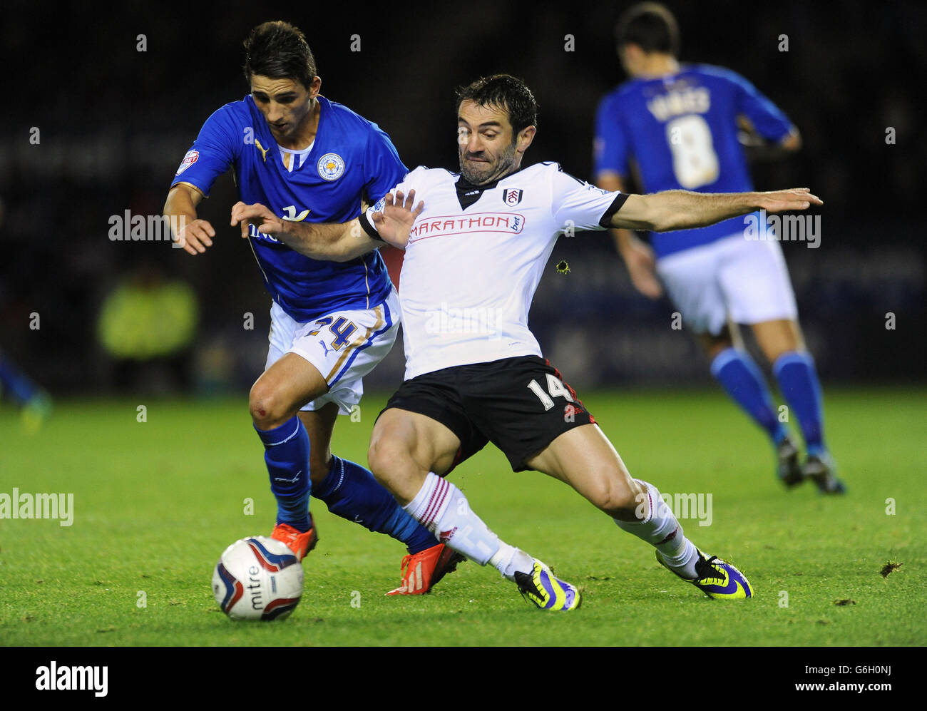 Leicester City's Anthony Knockaert and Fulham's Georgios Karagounis (right) battle for the ball during the Capital One Cup, Fourth Round match at the King Power Stadium, Leicester. Stock Photo