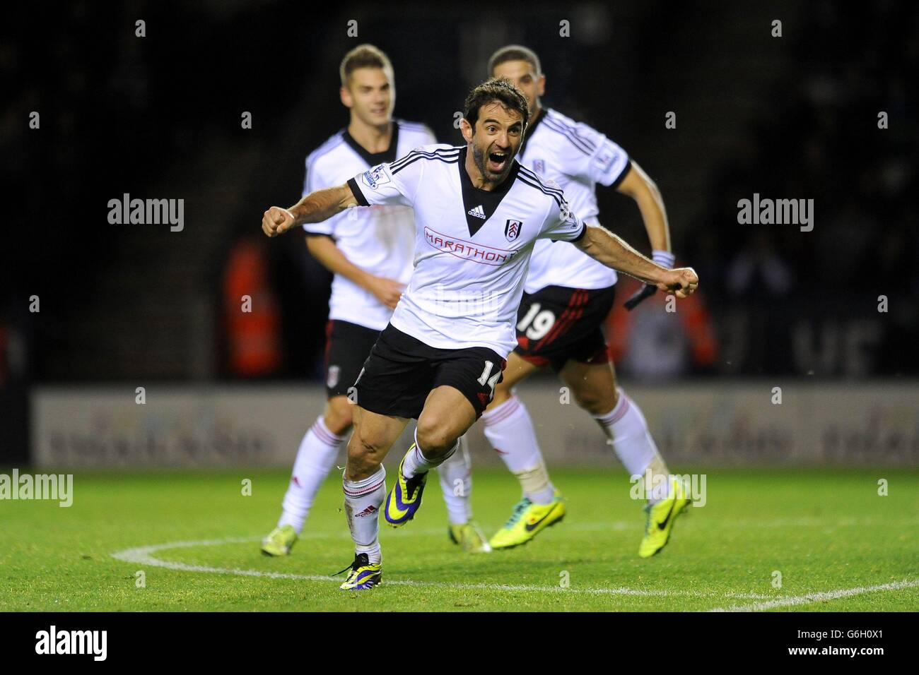 Fulham's Georgios Karagounis celebrates scoring their third goal of the game during the Capital One Cup, Fourth Round match at the King Power Stadium, Leicester. Stock Photo