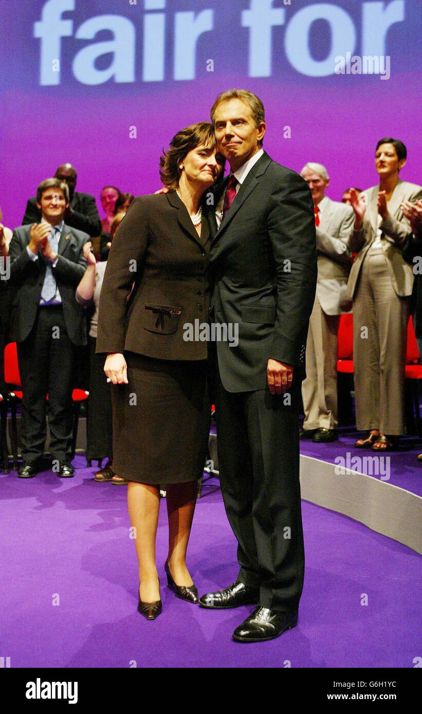 Prime Minister Tony Blair alongside his wife Cherie Booth after making