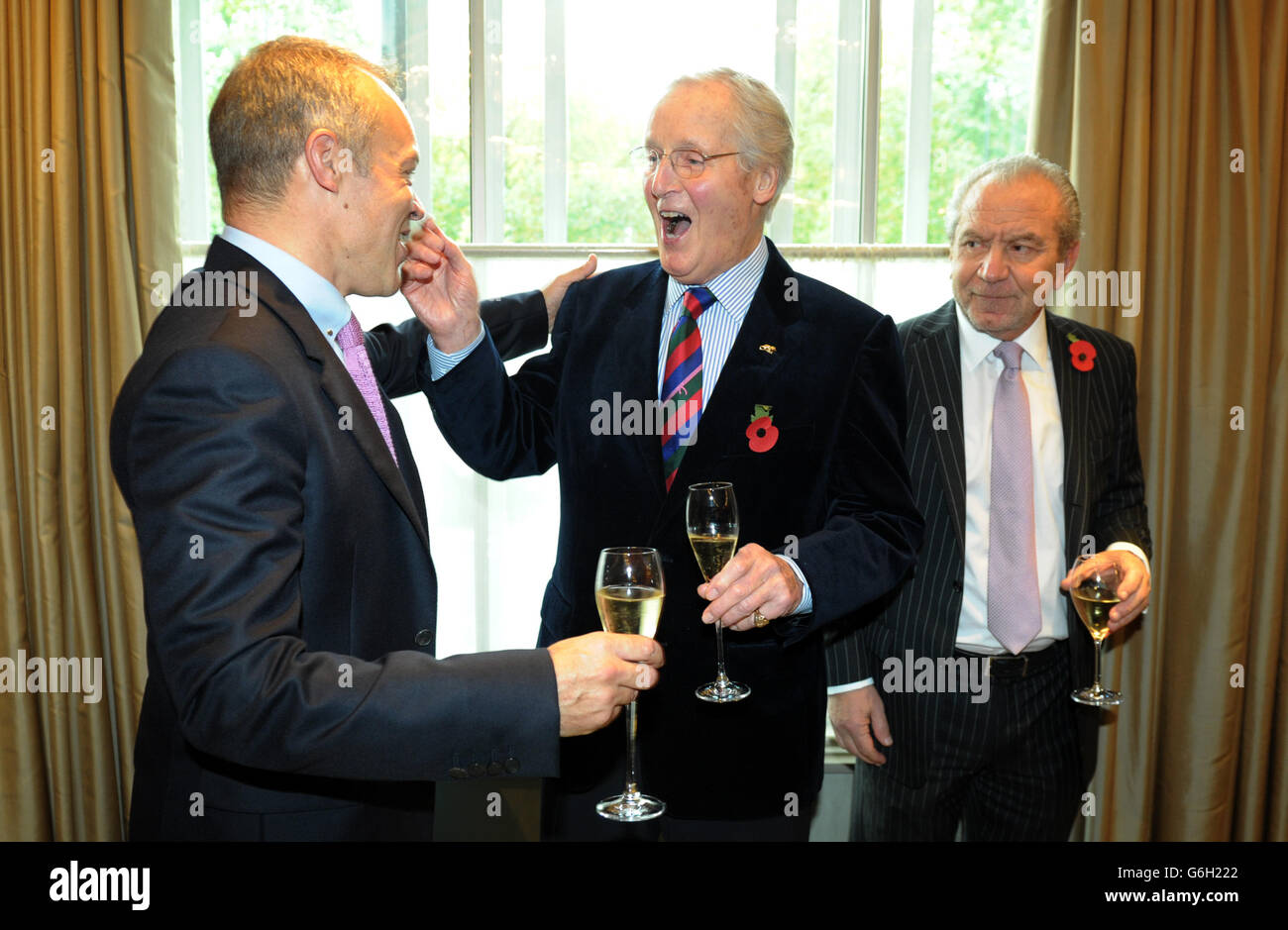 Guest of honour Graham Norton meets Nicholas Parsons (centre) and Lord Alan Sugar as he attends a tribute lunch hosted by The Lady Taverners at the Dorchester Hotel, London. Stock Photo