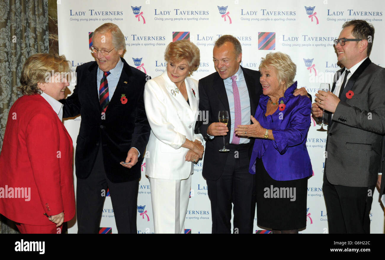 Guest of honour Graham Norton (centre) poses with (left to right) Sandy Toksvig, Nicholas Parsons, Angela Rippon, President Emeritus Judith Chalmers and Alan Carr during a tribute lunch hosted by The Lady Taverners at the Dorchester Hotel, London. Stock Photo