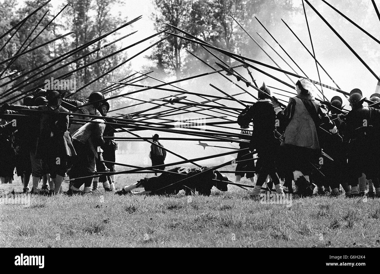 23/ English Civil War Society. A pikeman feigns death beneath a tangle of pikes during a lively re-enactment of 17th Century hostilities by the English Civil War Society at the historic Littlecote House, near Hungerford. The Tudor mansion, which was bought by millionaire businessman Peter de Savary in 1985, has been given a special award by the British Tourist Authority for a commercially operated tourist venue in its 'Come to Britain' award. Stock Photo