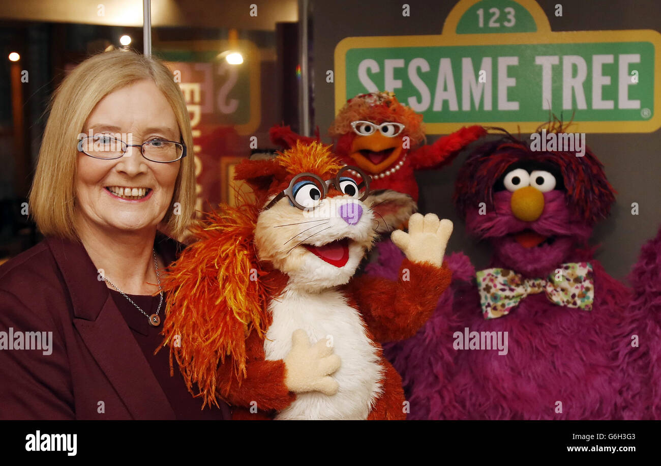 Holyrood Presiding Officer Tricia Marwick with characters from Sesame Street during the opening of exhibition Andrew Carnegie: The Legacy That Changed The World, that opened today at the Scottish Parliament in Edinburgh. Stock Photo