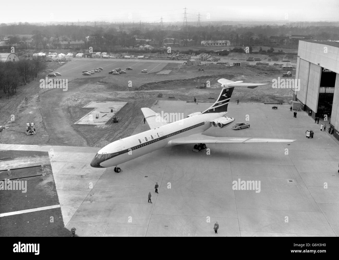 The new Vickers VC10 is taken from its hanger for the first time, at the Brooklands factory in Weybridge, Surrey. The plane is scheduled to make its first flight in May. The airliner, 158 feet long, has four Rolls-Royce Conway engines mounted in pairs at the tail. Forty-two of the planes have been ordered for BOAC. Automatic landing devices are to be incorporated in the VC10. Stock Photo