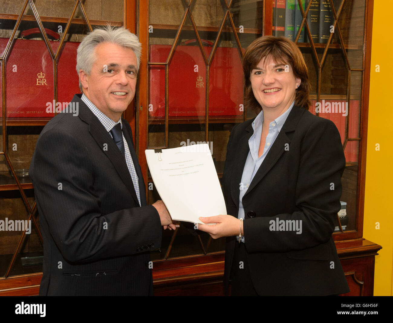 Economic Secretary to the Treasury Nicky Morgan (right) presents a signed decommissioning deed to Chief Financial Officer at Talisman Sinopec Robert Anderson, at HM Treasury, in Westminster, central London. Stock Photo