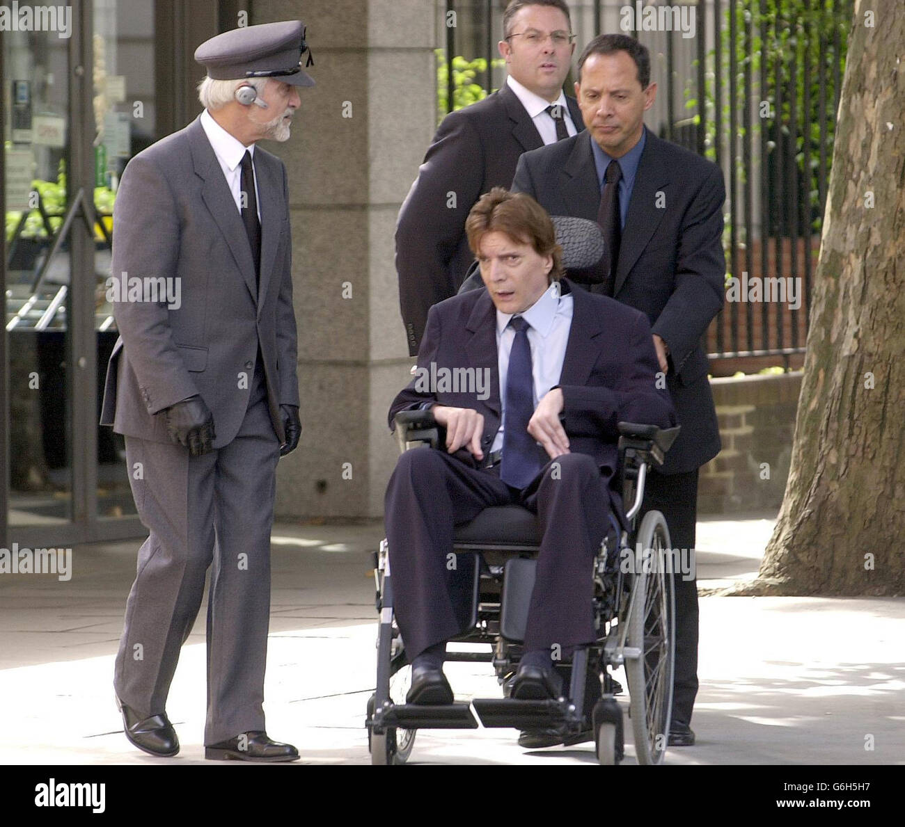 John Paul Getty III arrives at Westminster Cathedral in London for the memorial service for his father, billionaire philanthropist Paul Getty. More than 1,000 people were expected to gather to pay their respects to the man who once said 'as long as I have money, I will give it away'. Sir Paul, whose wealth derived from his family s oil fortune, died in hospital in April aged 70 while being treated for a chest infection. Stock Photo