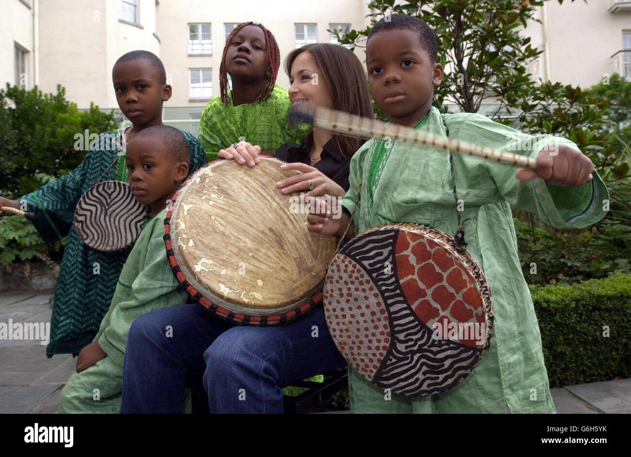 Caroline Corr, the drummer with the Irish band, The Corrs, promoting the Concern Fast 2003, in Dublin, with, from left, Shawndale, 5, Keanu, 3, Daniella, 7, and Timi, 4, originally from Nigeria and now living in Athy in Ireland. The Fast will take place on Friday November 28 and it is hoped that schools, businesses and individuals around the country will help Concern raise support for developing countries worldwide. Stock Photo