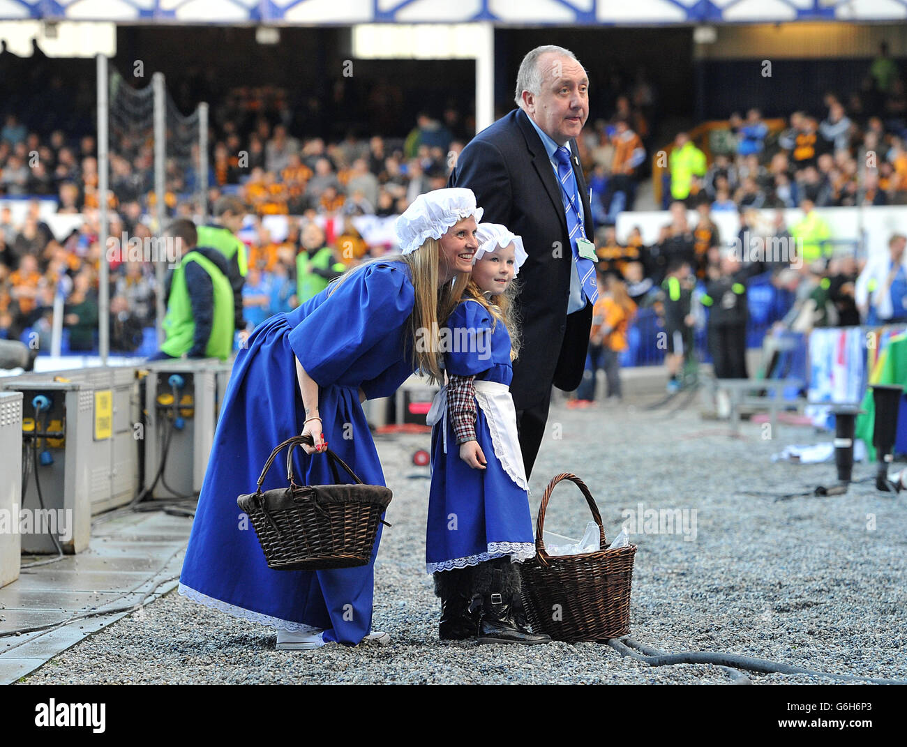 The Everton Toffee Girl while giving out sweets to fans before the game