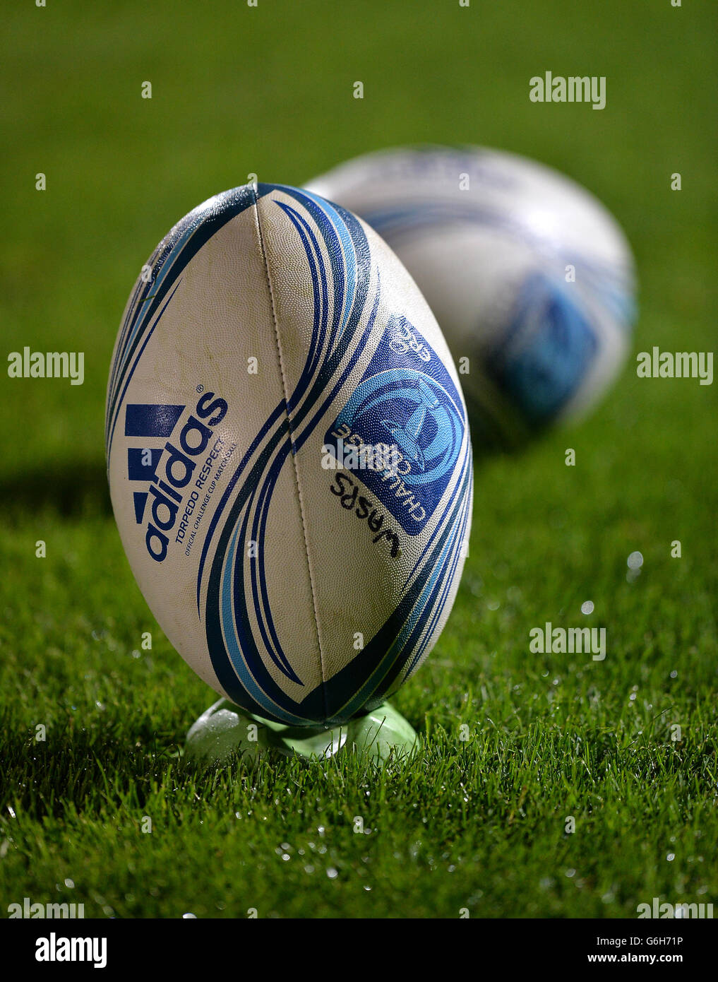 General view of an official Adidas Amlin Challenge Cup rugby ball on a  kicking tee Stock Photo - Alamy