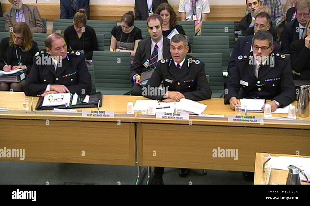 Chief Constable Chris Sims from West Midlands Police,Chief Constable David Shaw from West Mercia Police and Chief Constable Andy Parker from Warwickshire Police, answer questions in front of the Home Affairs Select Committee in the House of Commons over the Andrew Mitchell Plebgate scandal. Stock Photo