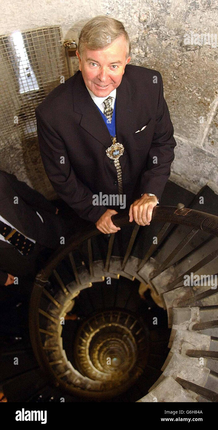 The Lord Mayor of London Alderman Gavyn Arthur smiles and attempts to catch his breath, after climbing the 311 steps to the top of the Monument, which was built to commemorate the great fire of London in 1666, in the City of London. The Mayor one was just one of hundreds of City workers making the climb up 202 feet to the top, for the Lord Mayor's charity appeal-Save the Children. Stock Photo
