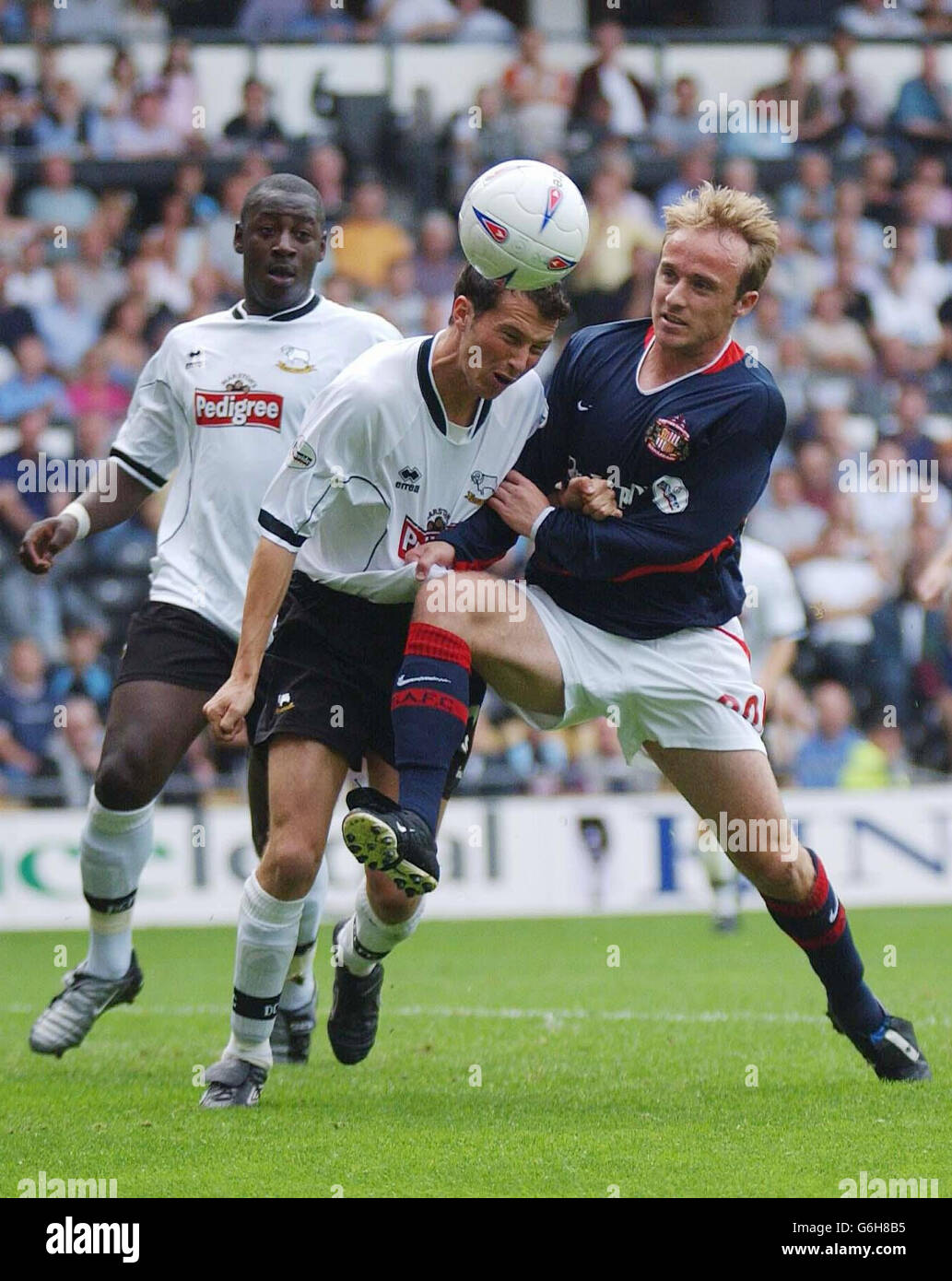 Derby County defender Richard Jackson clears with his head ahead of Sunderland's Thomas Butler during the Nationwide Division One match at Pride Park, Derby. NO UNOFFICIAL CLUB WEBSITE USE. Stock Photo