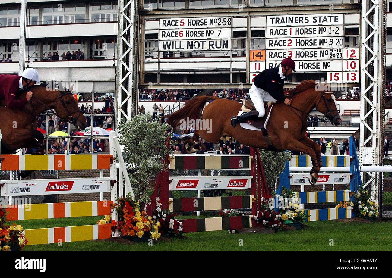 Showjumper Mark Armstrong (right) riding Rex and Scott Smith, riding Landwind 19, taking part in Speed Jumping at Ascot. Stock Photo
