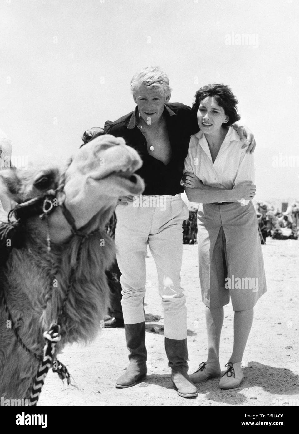 Peter O'Toole and his wife Sian Phillips pose with a camel in Jordan, where filming is taking place for Lawrence of Arabia. Stock Photo