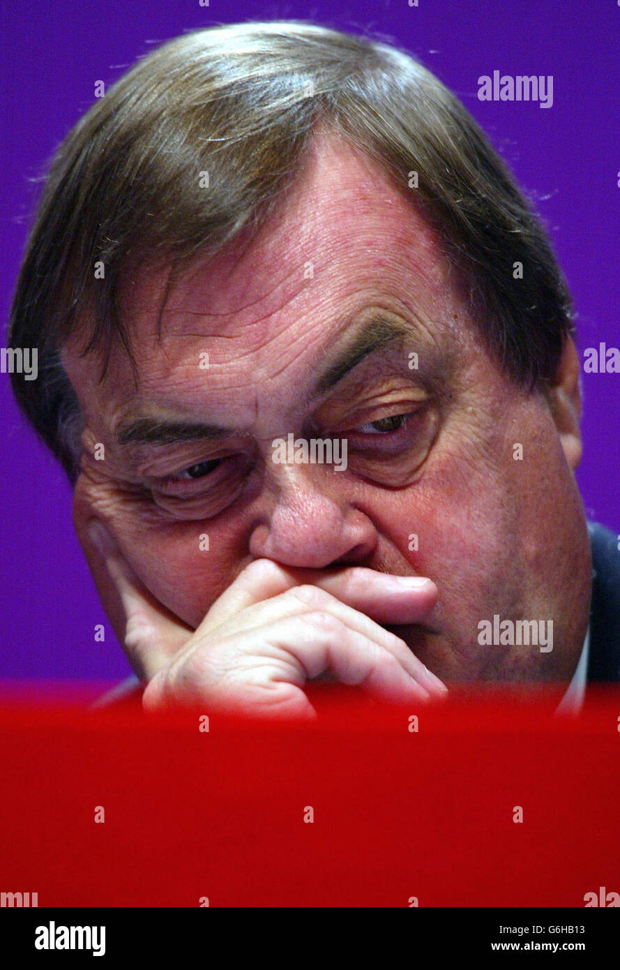 Deputy Prime Minister John Prescott listens to Gordon Brown, Chancellor of the Exchequer, delivering his speech to party delegates, on the second day of the annual Labour Party Conference in Bournemouth. Mr Brown today declared that the Government is steeled to take the top decisions needed to achieve social justice - warning that the Labour way will often involve taking 'the hard road'. In his keynote speech, he cautioned that only by being true to its values and objectives would the Government regain the public's trust following its recent troubles. Stock Photo