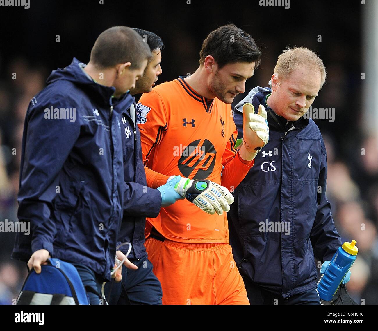Soccer - Barclays Premier League - Everton v Tottenham Hotspur - Goodison Park. Tottenham Hotspur goalkeeper Hugo Lloris is escorted off the pitch after a collission with Everton's Romelu Lukaku (not in picture) Stock Photo