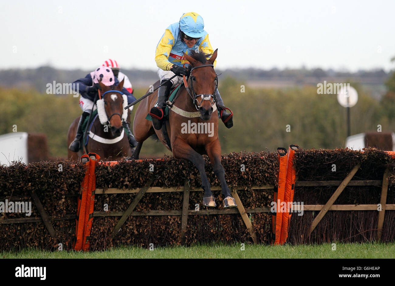 Carhue Princess ridden by Felix de Giles jumps the last on their way to victory in the Haygain Hay Steamers Clean Healthy Forage Mares&acute; Handicap Hurdle at Towcester Racecourse, Northamptonshire. Stock Photo